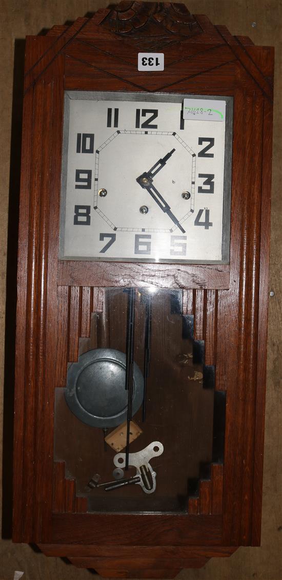 An Art Deco oak chiming wall clock